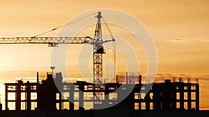 Multistorey houses and industrial cranes