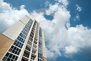 Multistorey residential house on blue sky background