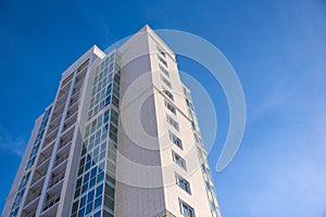 Multistorey residential house on blue sky background