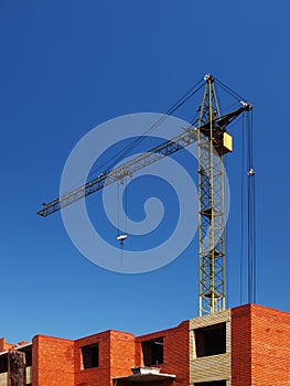 Multistory building under construction with crane