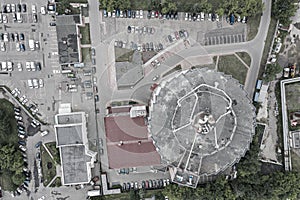 Multistory car park and parking lot with cars. top view aerial photo
