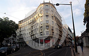 Multistory mid-20th-century residential building with round corner section, in Rato district, Lisbon, Portugal photo
