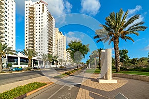 Multistory modern buildings and pedestrian walkway in Ashkelon, Israel.