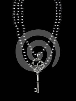 A multistrand black pearls necklace with a skeleton key motif. Gothic art. AI generation