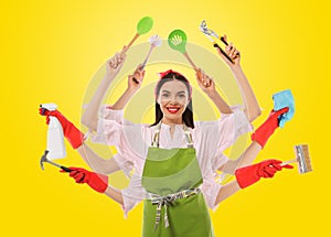 Multitask housewife with many hands holding different stuff on yellow background