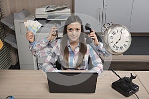 Multitasking business woman is a real miracle at work