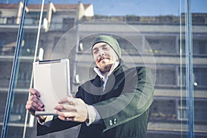 Multitasking man using tablet, laptop and cellhpone