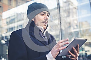 Multitasking man using tablet, laptop and cellhpone