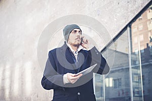 Multitasking man using tablet, laptop and cellhpone