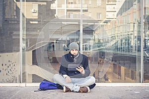 Multitasking man using tablet, laptop and cellhpone