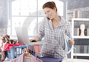 Multitasking woman at home