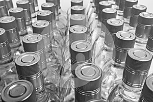 Multitude of pure alcohol bottles not labeled. Bottles of Home Alcoholic Beverages Isolated On White. Small liquor production