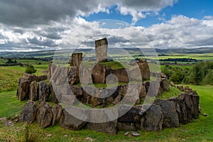 The multiverse stone circle with the Andromeda and Milky Way hills behind in the Crawick Multiverse