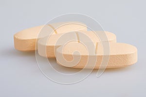 Multivitamin Multimineral Supplement. Large tablets isolated on white