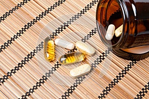 Multivitamin Pills in a brown medicine jar