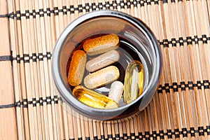 Multivitamin Pills in a brown medicine jar