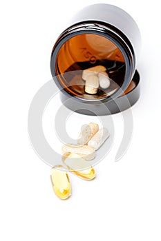 Multivitamin Pills in a brown medicine jar