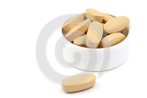 Multivitamin pills in the plastic cap photo