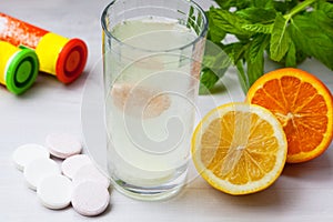 Multivitamin tablet in water photo