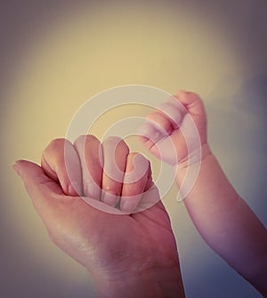 Mum and baby hands