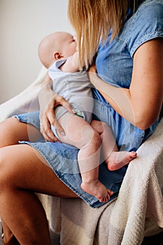 Mum is breastfeeding a child.