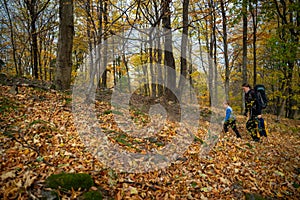 Mum and child are walking along the mountain hiking trail. Family spending time