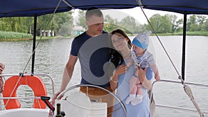 Mum,dad and son in open air, happy parents with child on rest in background nature and water, mother, father and little