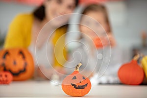 mum and daughter carved pumpking and decoration at home