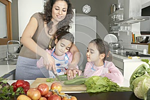 Mum and Daughter Chopping Veggies