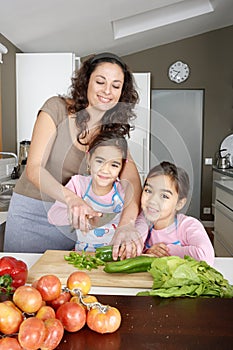 Mum and Daughter Chopping Veggies