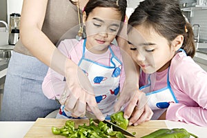 Mum and Daughter Chopping Veggies