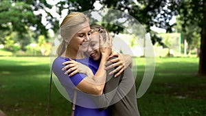 Mum and daughter embracing, student came home for holiday, long awaited meeting photo