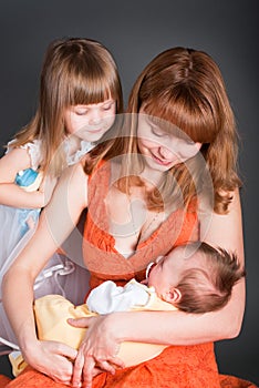 Mum with a daughter and newborn kid