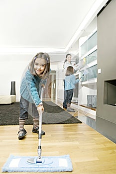 Mum and Daughters Cleaning Living