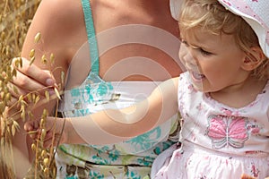 Mum with the doughter in the field