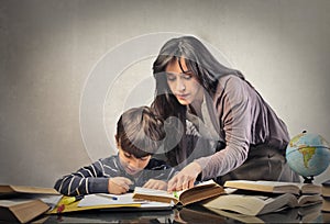 Mum helping his son with homework