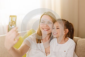 Mum and her cute daughter child girl are playing, smiling and hugging. Happy mother& x27;s day.