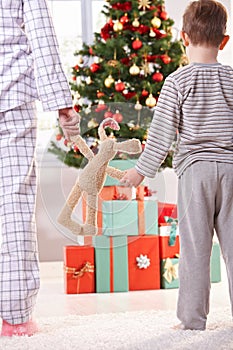 Mum, little son and toy bunny at christmas