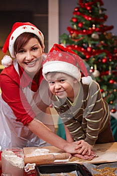 Mum and son having fun at christmas baking