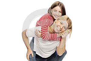 Mum with a teenager daughter laughing and hugging, isolated on white background