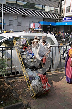 Mumbai/India - 24/11/14 - Dabbawala delivery at Churchgate Railway Station in Mumbai with dabbawala unloading tiffins