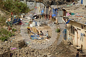Indian children playing on the street near garbage in Dharavi Slum at Mumbai. Top view