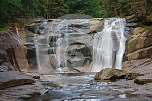 Mumlava waterfall. Mountain river Mumlava, Krkonose national park, Czech Republic, summer afternoon