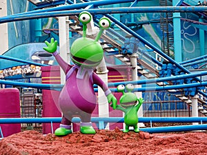 Happy frogs sculptures at the roller coaster ride Ghost Chasers