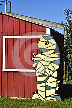 Mummy in Front of Red Barn