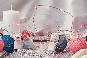 Mumps small pig and snowman from marshmallows against the background of Christmas decoration