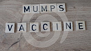 Mumps vaccine concept. Syringe on the table