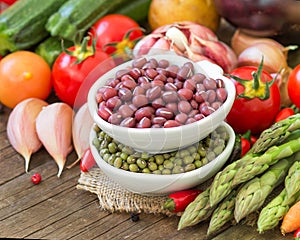 Mung and azuki beans in a bowl and vegetables