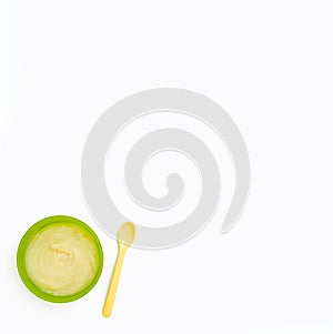 Mung bean and broccoli baby puree in a separate bowl on a white background, clipping path, top view