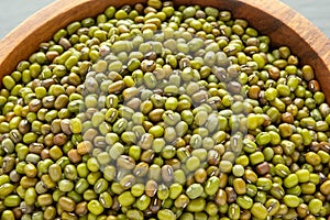 Mung beans or mash peas in wooden bowl